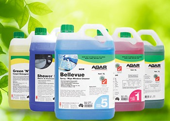 Bottles of Agar's Green Cleaning Range against backdrop of lush greenery